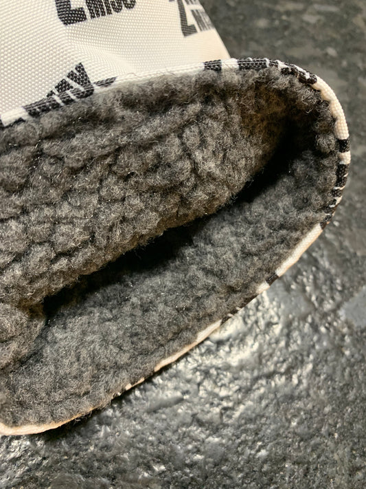 Interior of white headcover showing fur material lining